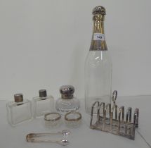 Silver ware: to include a six division toastrack; and a cut glass inkwell with silver collar and cap
