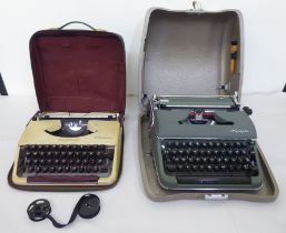 Two vintage portable Olympia manual typewriters