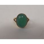 A 9ct gold jade set solitaire ring
