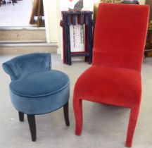 A modern fully upholstered pillar box red bedroom chair with a high back and overstuffed seat; and a