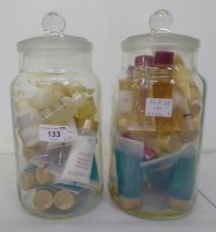 A vast quantity of creams and shampoos samples from Elemis and Champneys, in two covered glass jars