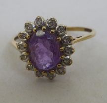 A 9ct gold amethyst and diamond ring