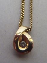 A 9ct gold and diamond set pendant, on a fine neckchain and ring bolt clasp