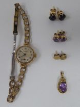 9ct gold mounted jewellery; and a 9ct gold cased wristwatch, faced by an Arabic dial, on a gold