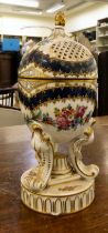 A Dresden porcelain hinged egg cup design trinket box, on a tripod case and circular plinths  6"h