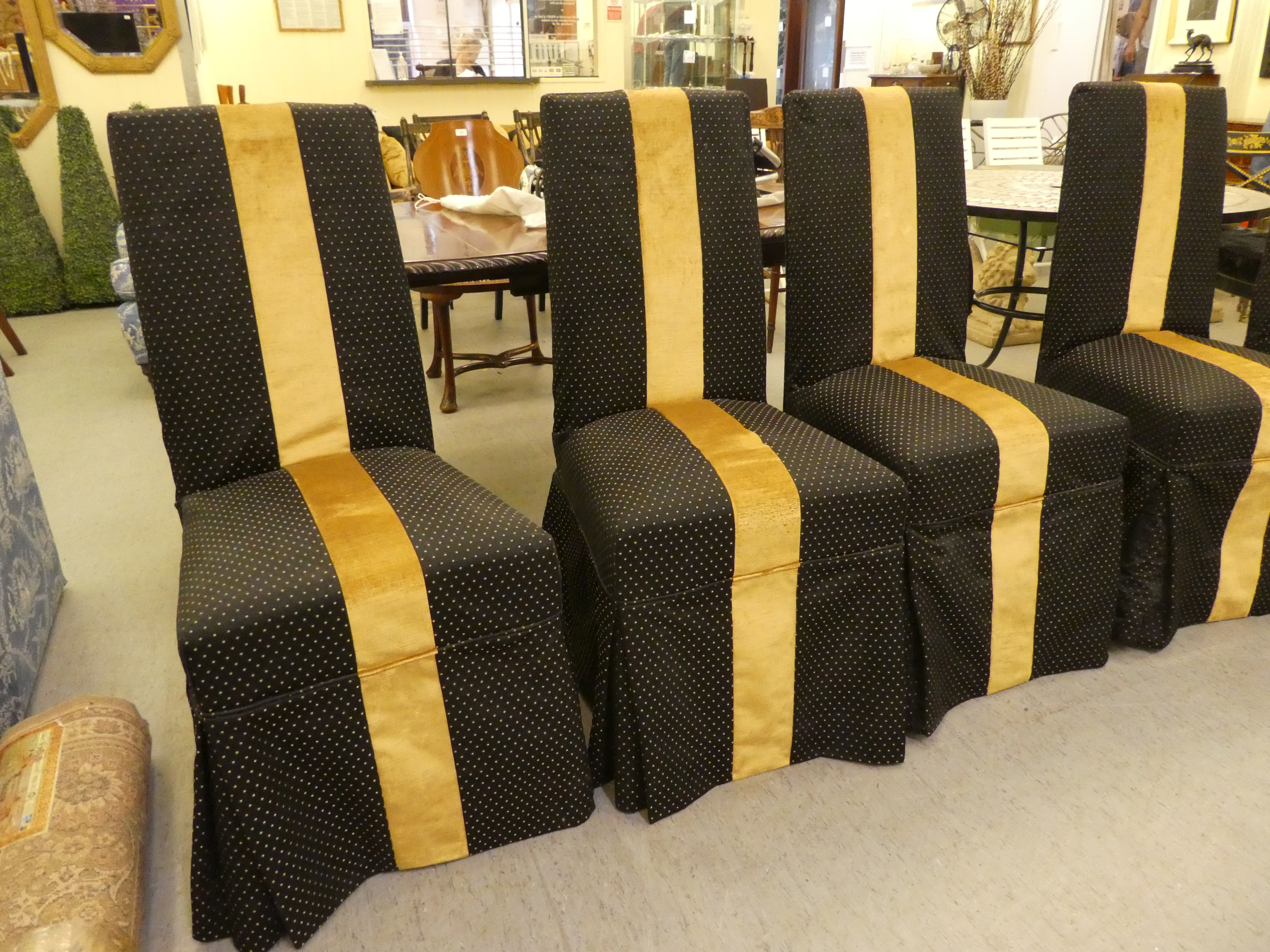 A set of six black and gold fabric covered dining chairs, raised on stained beech legs - Image 2 of 4