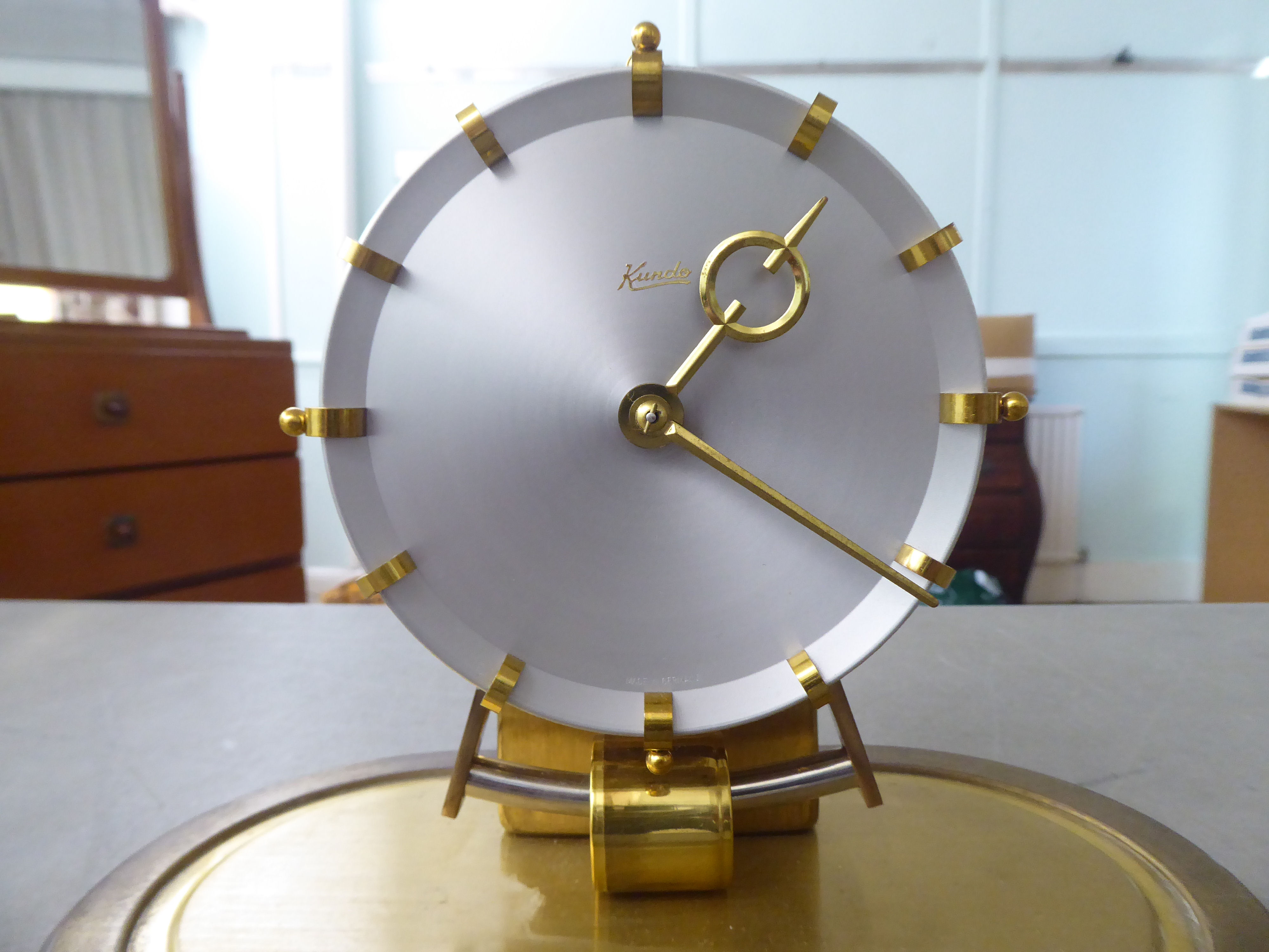 A Kundo Electromagnetic mantel clock; the exposed movement faced by a baton dial  9''h under a glass - Image 2 of 6