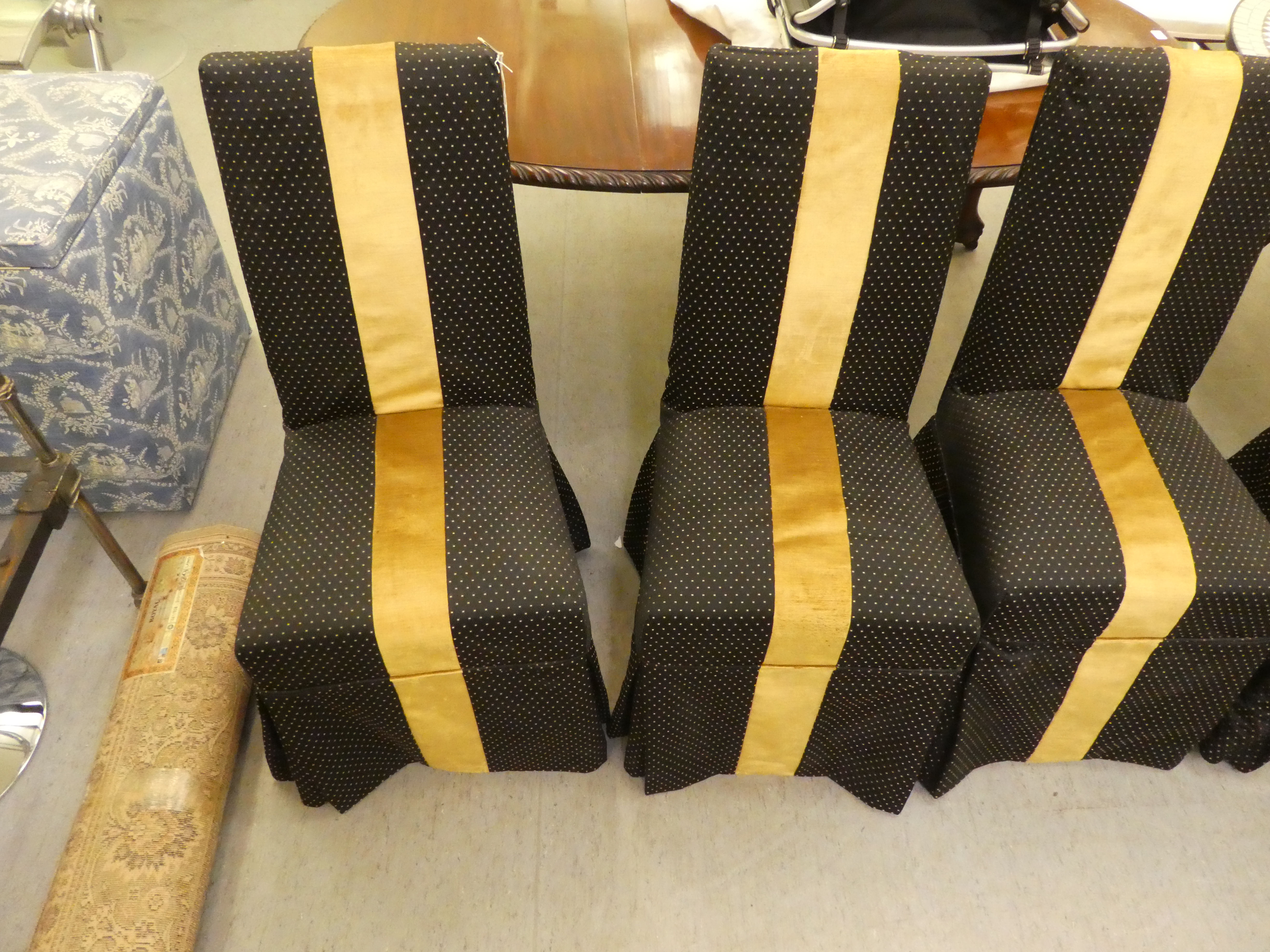 A set of six black and gold fabric covered dining chairs, raised on stained beech legs - Image 4 of 4