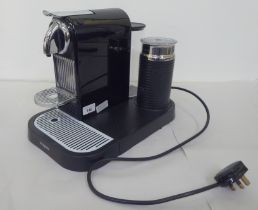 A Magimix Naspresso coffee machine with booklet
