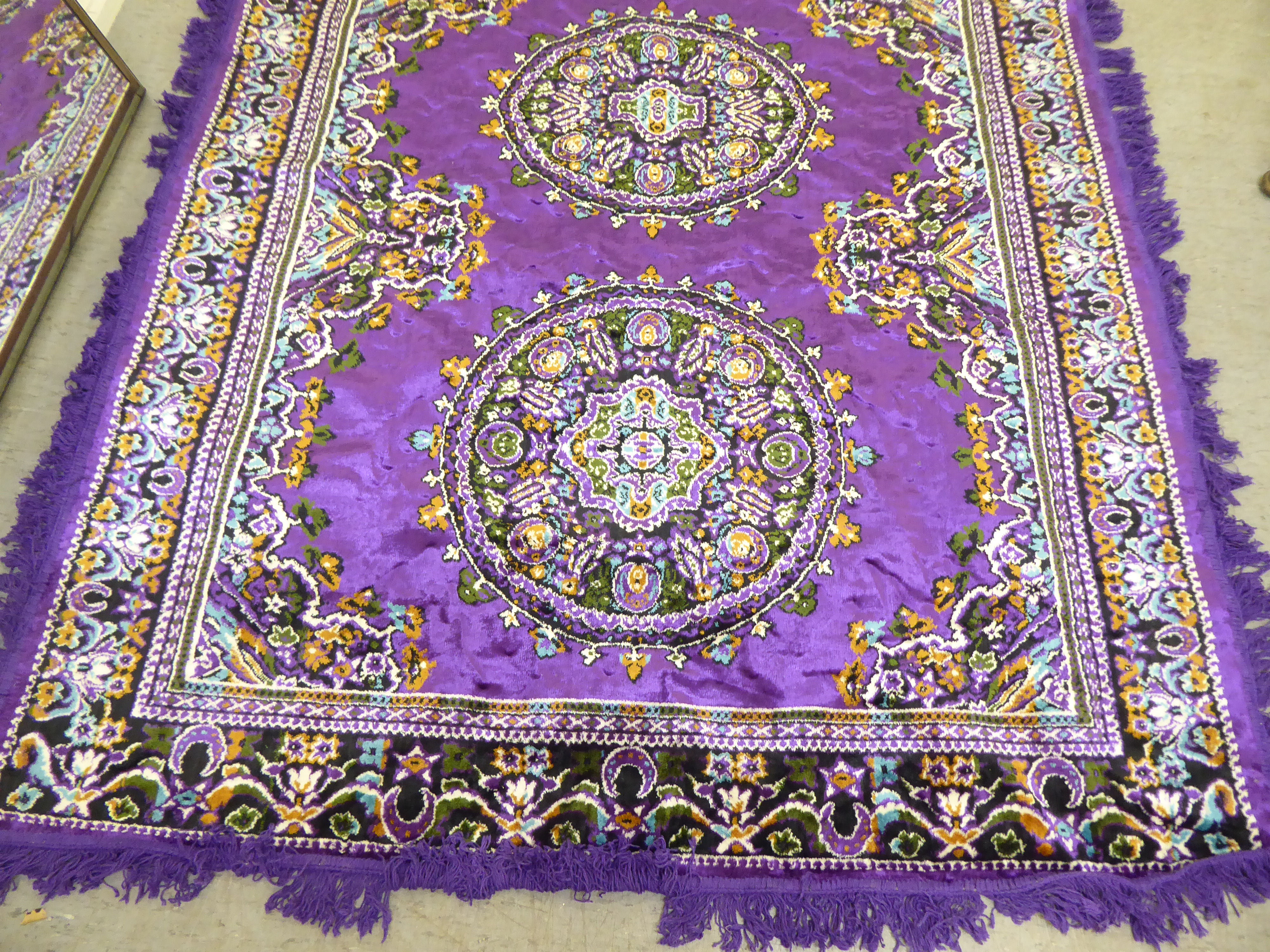 A Persian design rug, decorated with floral motifs, on a purple ground  86" x 56" - Image 2 of 4