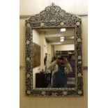 A modern Middle Eastern inspired mirror, decorated in black and white floral designs  41" x 30"