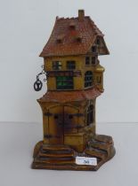 A mid 20thC novelty table lamp, fashioned in the manner of a Bergman Cobbler house  11"h  (for