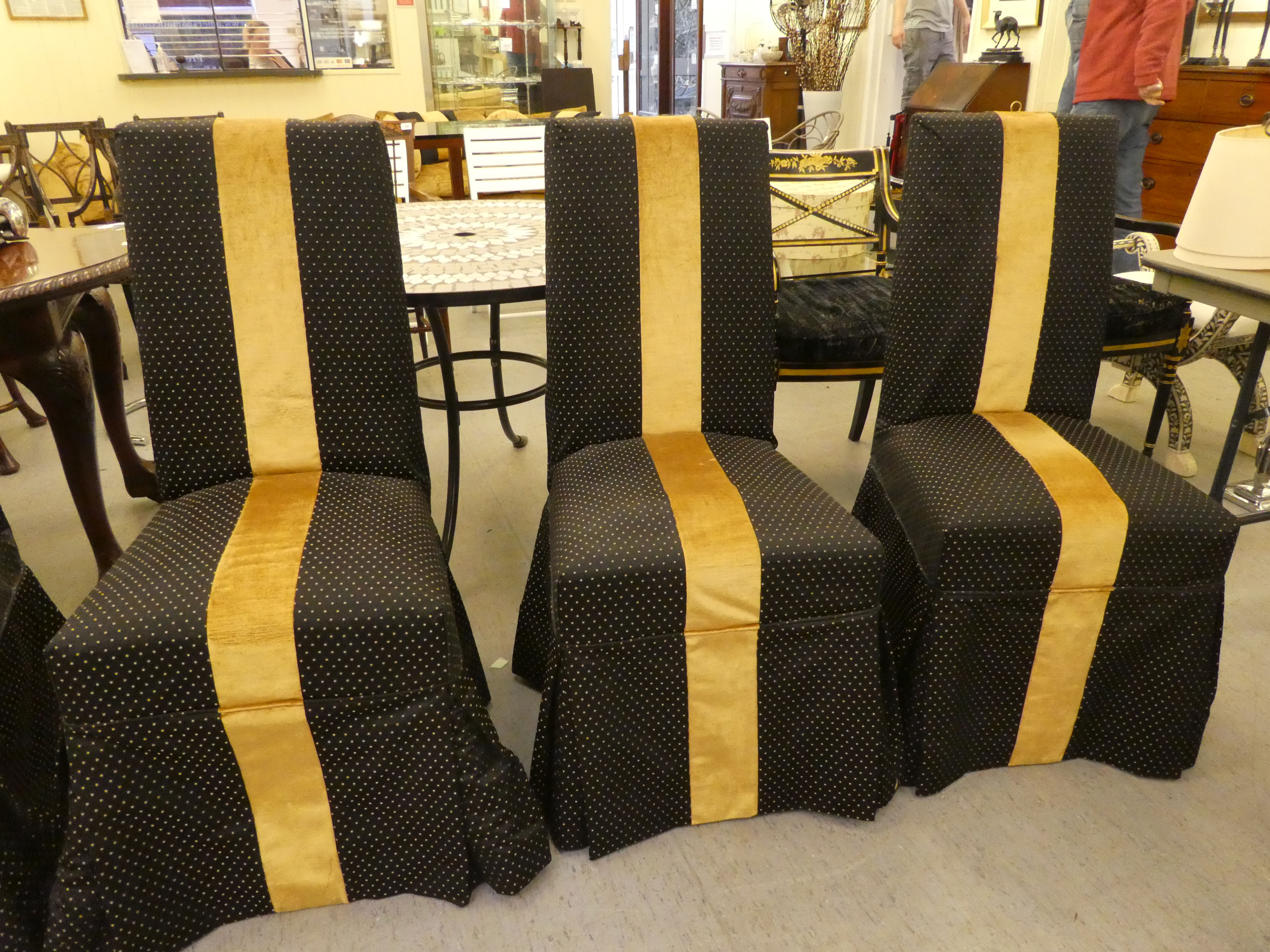 A set of six black and gold fabric covered dining chairs, raised on stained beech legs - Image 3 of 4