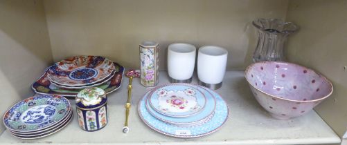 A mixed lot: to include a pair of early 20thC Japanese porcelain Imari plates, decorated with flora