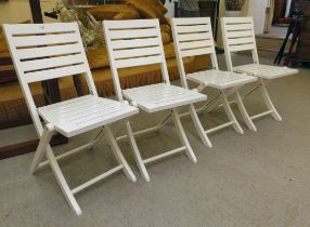 A set of four modern white painted folding patio chairs of slatted construction