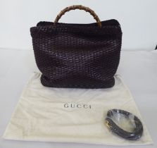 A Gucci chocolate brown woven hide tote bag  no.001-2404-1577 with a bamboo handle, shoulder strap