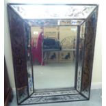 A modern Italianate mirror with bevelled and decorated frames  40" x 30"