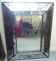 A modern Italianate mirror with bevelled and decorated frames  40" x 30"