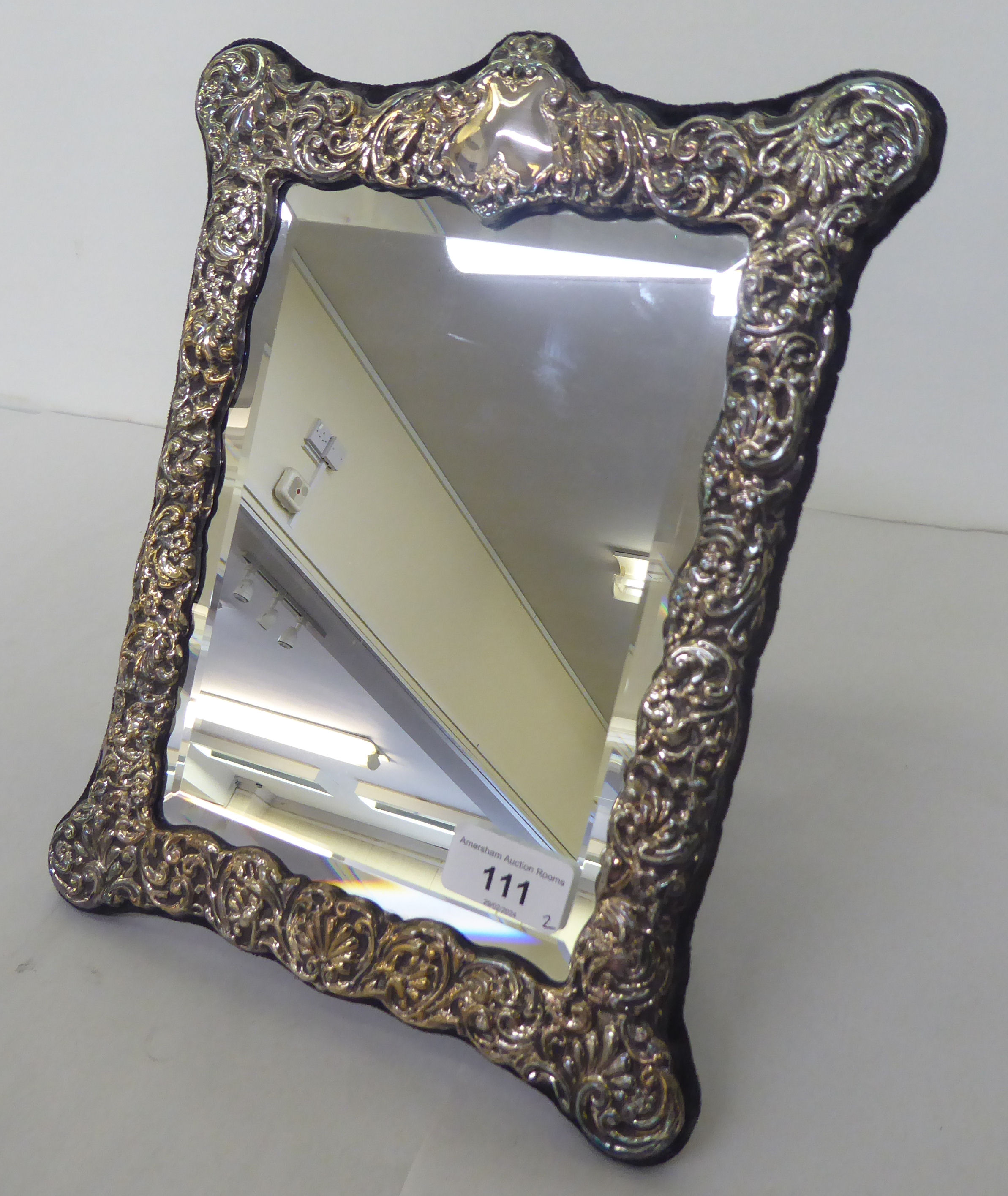 A Victorian style dressing table mirror, the bevelled plate set in an overlaid and embossed silver - Image 4 of 4