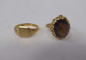 A 9ct gold signet ring; and a 9ct gold smoky quartz set ring