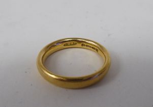 A 22ct gold wedding ring