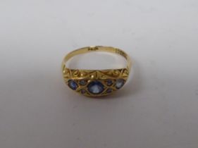 An 18ct gold sapphire and diamond set gypsy style ring