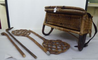 A late Victorian/Edwardian woven split cane folding campaign/anglers chair with a storage