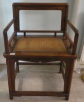 A 20thC Chinese Huanghuali style fruitwood framed chair