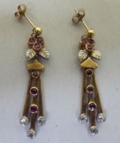 A pair of yellow metal pendant earrings, set with rubies and diamonds