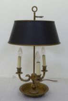 A modern brass table lamp with three scrolled branches and a height adjustable shade  24"h
