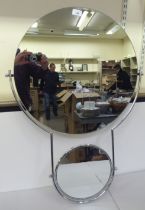 An OMIK double plate tubular metal framed, combination, pivoting bathroom and shaving mirror  23"dia