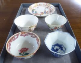 18thC and later Chinese porcelain items: to include a tea bowl and saucer, decorated with figures in