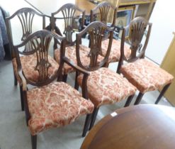 A set of six Hepplewhite design mahogany framed dining chairs, the red floral patterned fabric