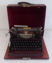 A vintage Voss Bakelite and cast metal manual typewriter, in a hard carrying case