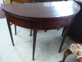 A George III string inlaid mahogany D-end tea table, raised on a rear gateleg action and square,