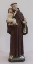 A 20thC plaster figure, Saint Anthony and child  21"h