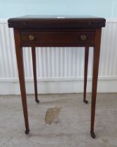An Edwardian satinwood inlaid mahogany envelope card table, raised on square, tapered legs and