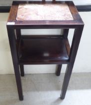 A mid 20thC Chinese fruitwood two tier hall table, raised on square legs  32"h  16"w