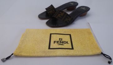 A pair of ladies Fendi stitched black leather and fabric, low heeled, open toe sandals  size 39.5