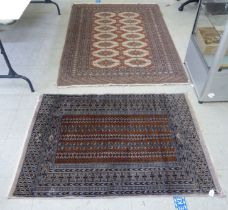 Two rugs, a Turkoman  36" x 54"; and a Persian  50" x 70"