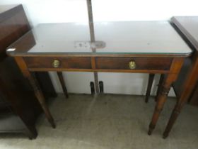 A late 19thC mahogany two drawer side table, raised on ring turned, tapered legs  29"h  36"w