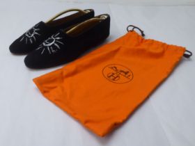 A pair of ladies Hermes black suede pumps with stitched sun motifs  size 38.5 with a an orange