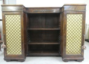 A late George III mahogany inverted breakfront, open front cabinet bookcase, raised on bracket feet