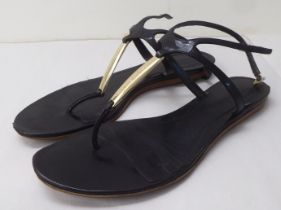 A pair of ladies Alexander McQueen black leather sandals  approx. size 39 with a dust bag