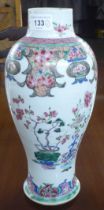 A late 18thC Chinese porcelain vase of baluster form, decorated in floral and other designs  (