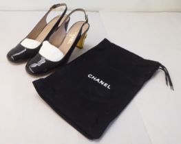 A pair of ladies Chanel black leather heeled sling-backs  size 39 with a dust bag