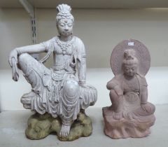 A white painted terracotta figure, a seated deity  20"h; and a similar stone example  15"h