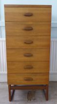 A G-Plan teak dressing chest with six drawers, raised on splayed legs  45"h  20"w