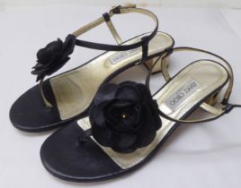 A pair of ladies Jimmy Choo black leather, low heeled, open toe shoes with a floral motif  size 39.5