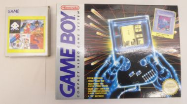 A Nintendo Game Boy  boxed with three game cartridges